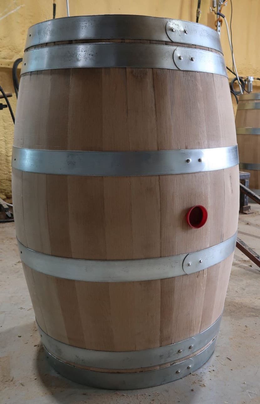 Finished Standard Cooperage white oak barrel with galvanized hoops and a visible red-rimmed bung opening