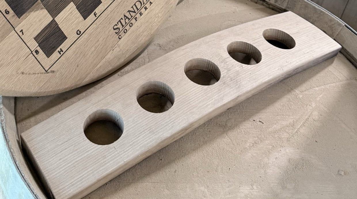 Oak whiskey flight holder made from a cooperage stave